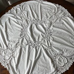 Vintage white round hand batten tablecloth.